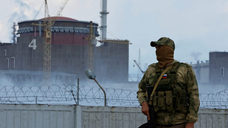 FILE PHOTO: A serviceman with a Russian flag on his uniform stands guard near the Zaporizhzhia Nuclear Power Plant in the course of Ukraine-Russia conflict outside the Russian-controlled city of Enerhodar in the Zaporizhzhia region, Ukraine August 4, 2022